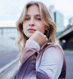 Blonde person with contemplative expression